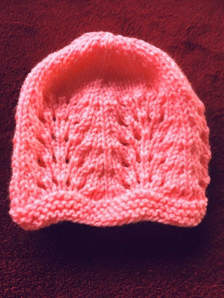 Hand knitted baby outfit in bubblegum pink