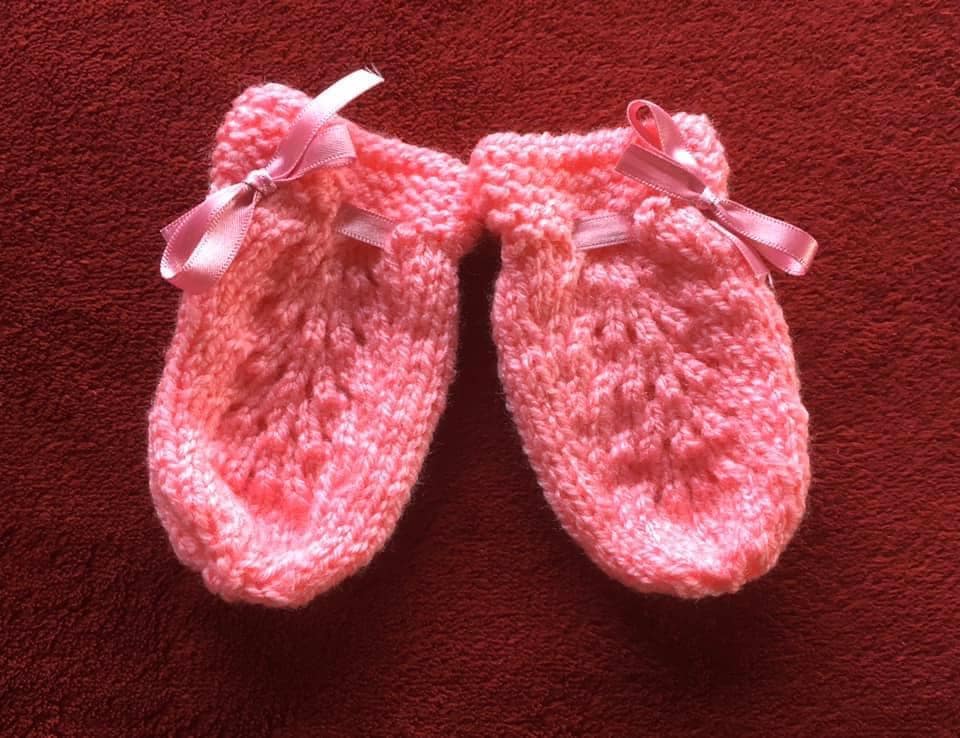 Hand knitted baby outfit in bubblegum pink