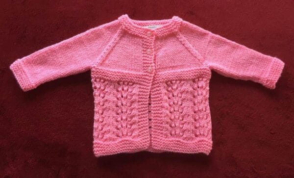 Hand knitted baby outfit in bubblegum pink - product image 2