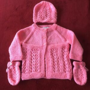 Hand knitted baby outfit in bubblegum pink