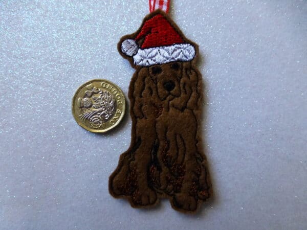 Chocolate spaniel in santa hat – hanging decoration for your Christmas tree - main product image