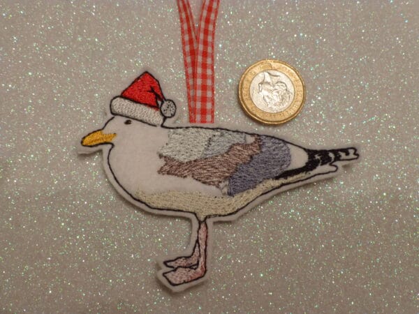 Seagull wearing Santa hat hanging decoration . gift tag - main product image