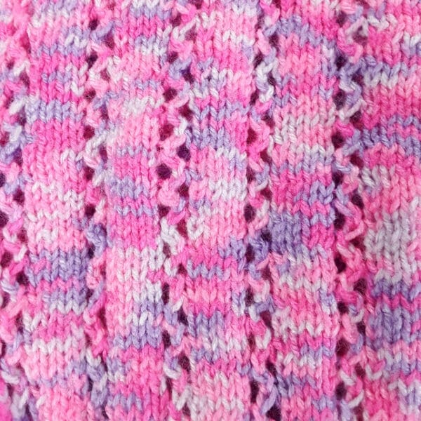 Hand knitted baby jumper in purples and pinks 6 – 12 months - product image 3