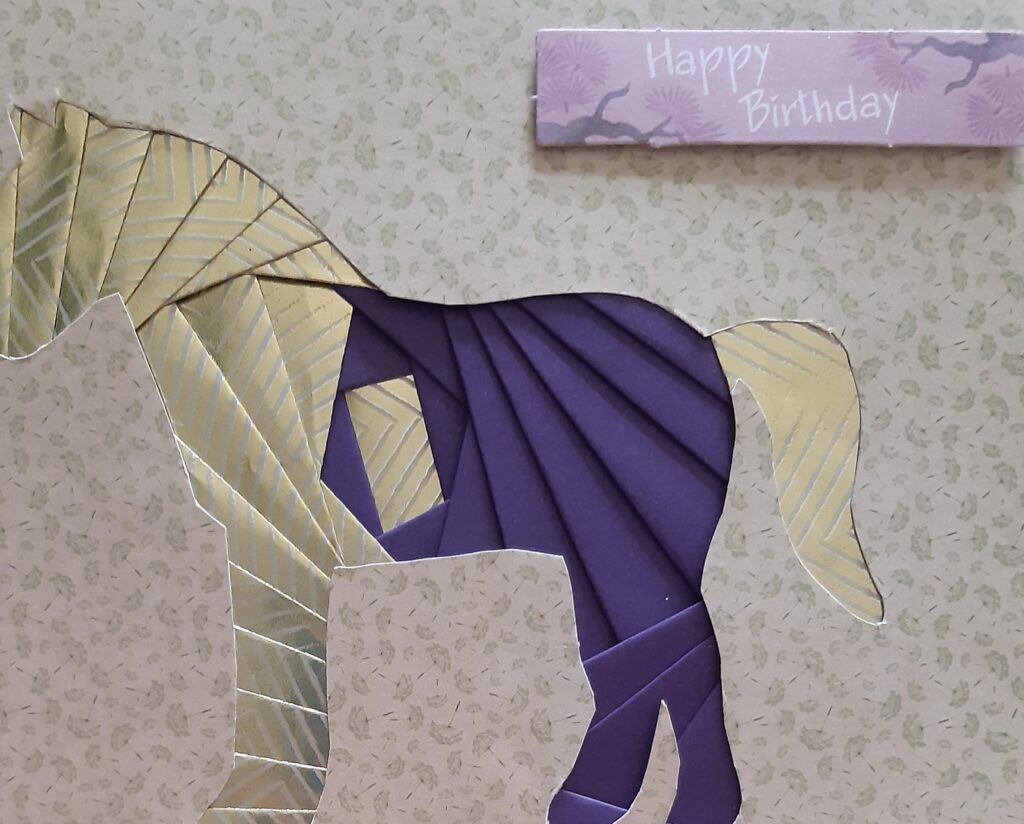 Purple and gold horse happy birthday card.