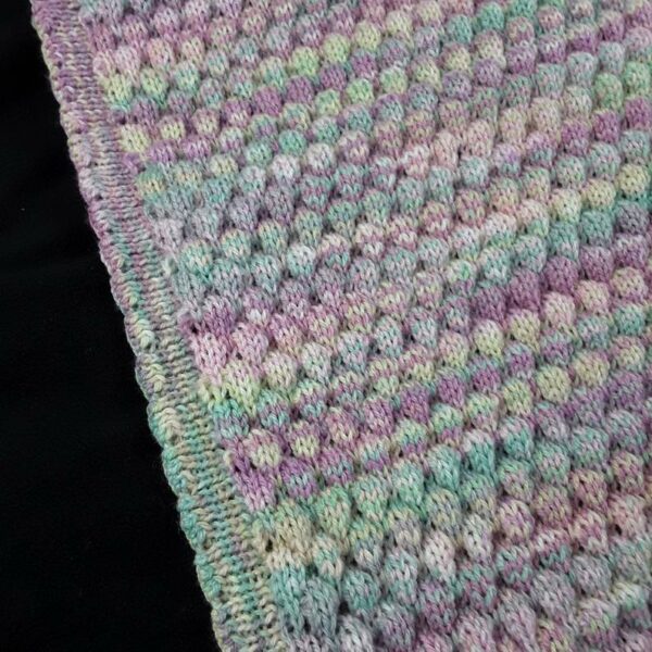 Hand knitted baby multicoloured bobble pram blanket – lilac, pink, green - product image 5