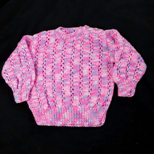 Hand knitted baby jumper in purples and pinks 6 – 12 months - main product image