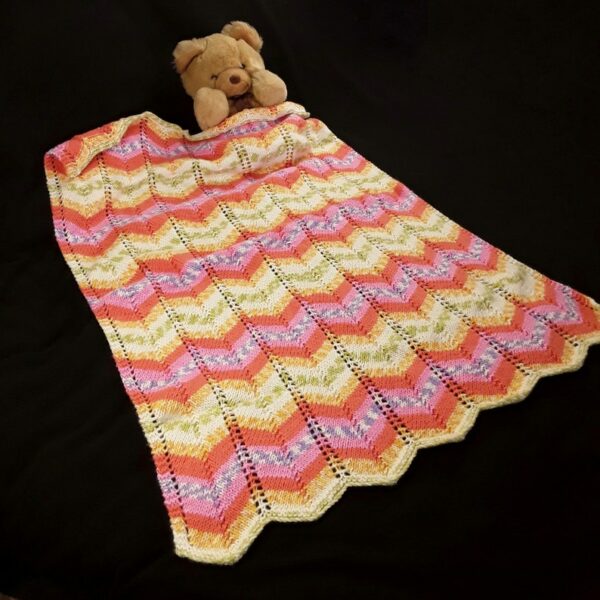 Hand knitted baby pram blanket – pink, orange, mauve, green, yellow, white chevron - product image 2