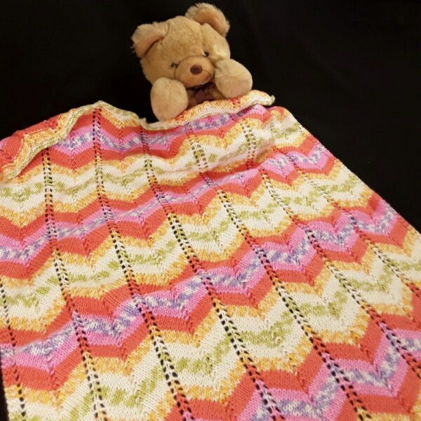 Hand knitted baby pram blanket – pink, orange, mauve, green, yellow, white chevron - product image 3