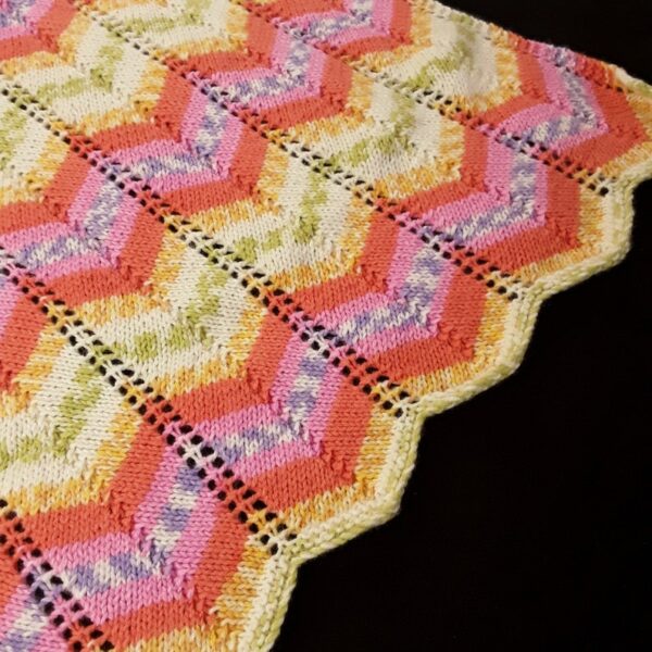 Hand knitted baby pram blanket – pink, orange, mauve, green, yellow, white chevron - product image 5