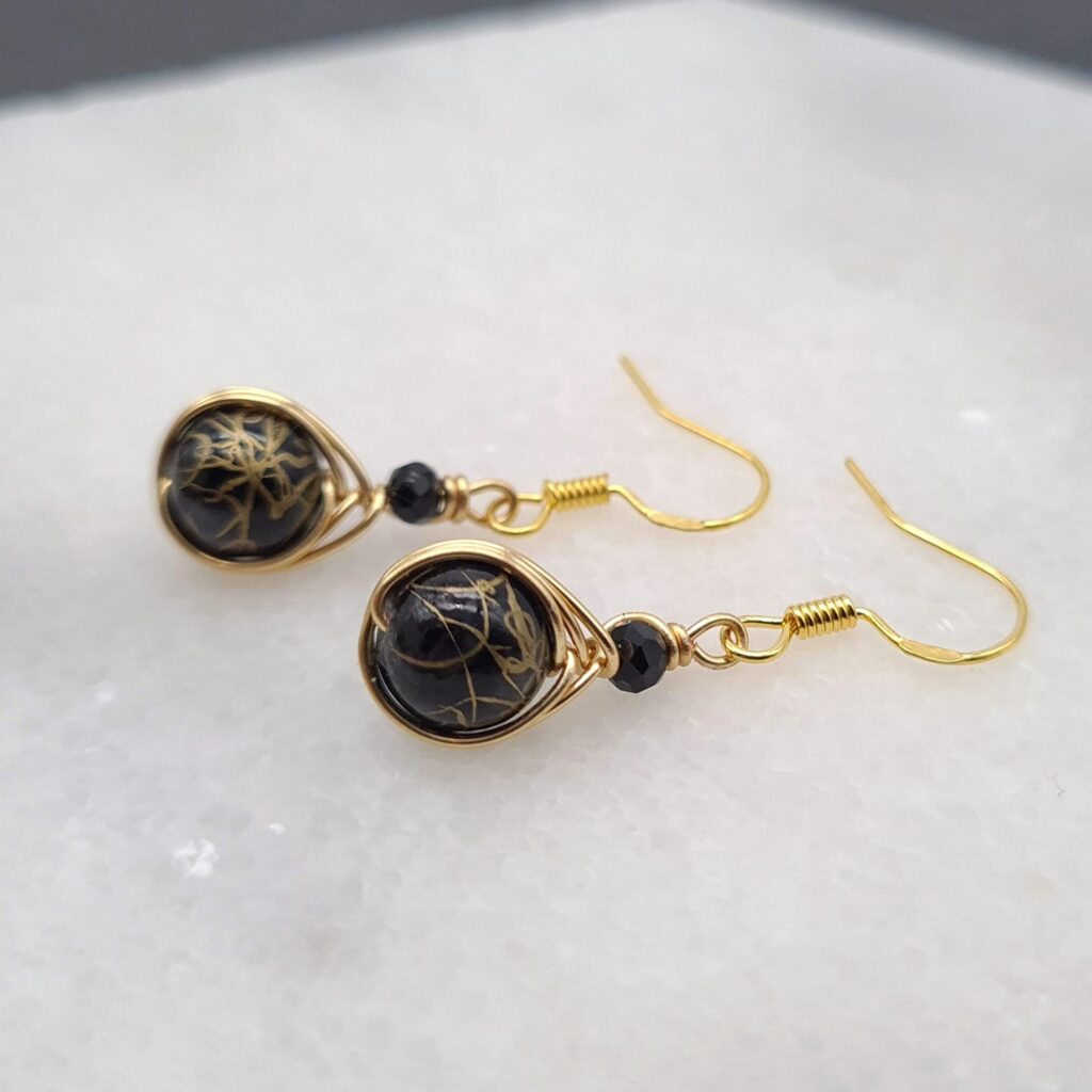 Hand made gold wrapped earrings with black beads