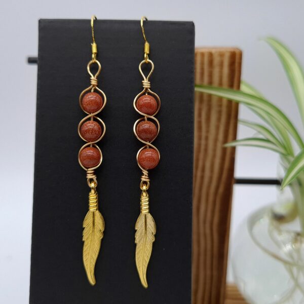 Handcrafted Long Drop Gold Feather Earrings With Wrapped Gold Sandstone Beads - product image 5