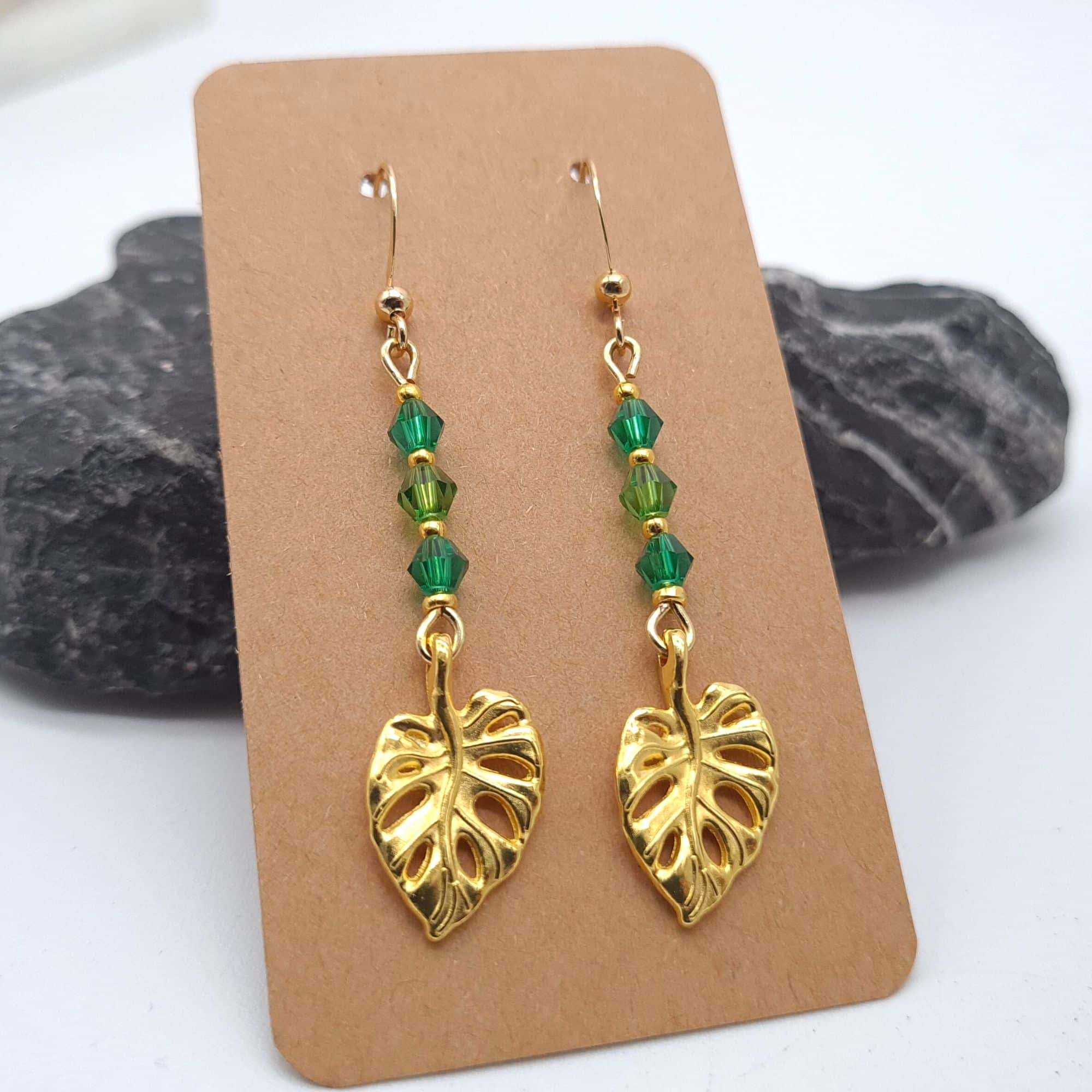Gold Earrings With Green Glass Beads and Monsterra Leaf Charms - main product image