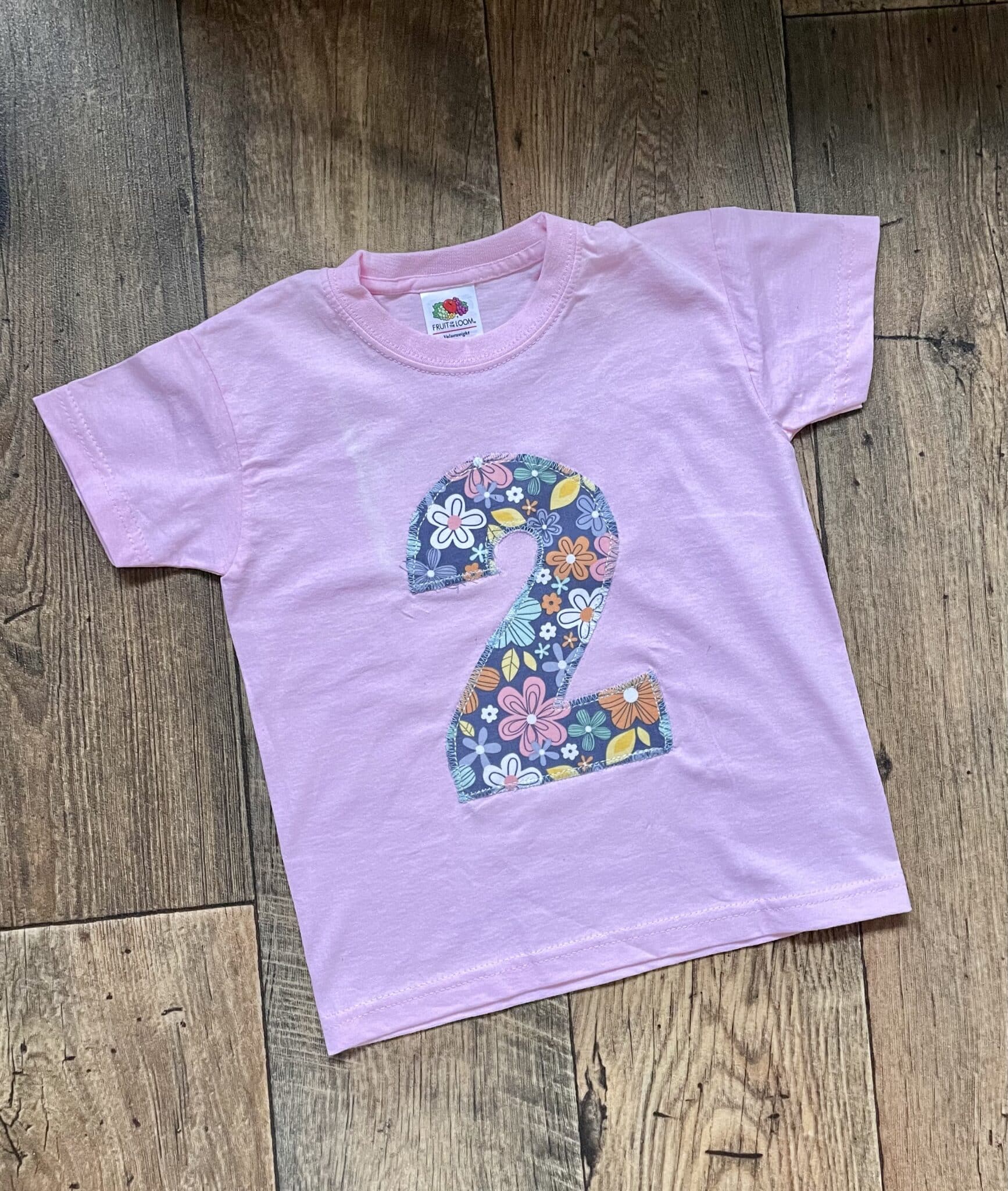 ON SALE Age 2 appliqué birthday t-shirt. Pink with Navy floral print - main product image