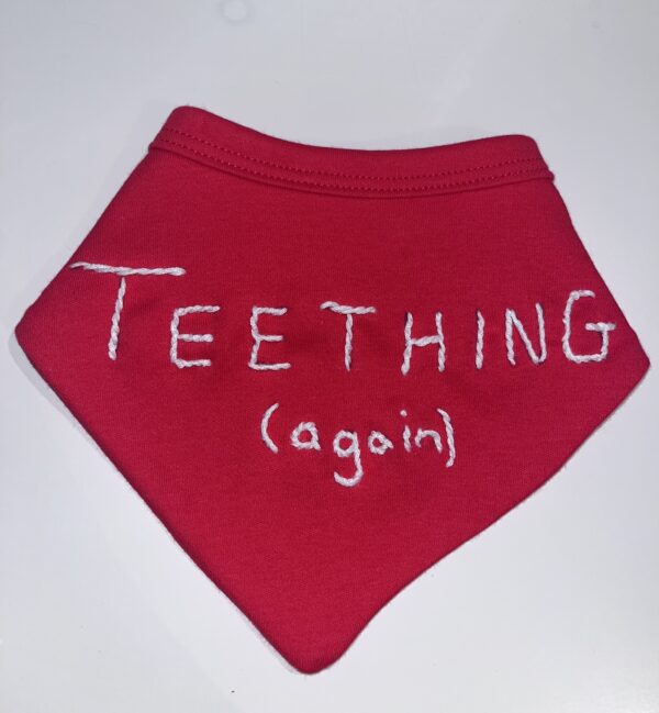 “TEETHING AGAIN” hand embroidered dribble bib - main product image