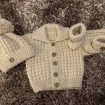 Hand knitted baby cardigan, hat and booties
