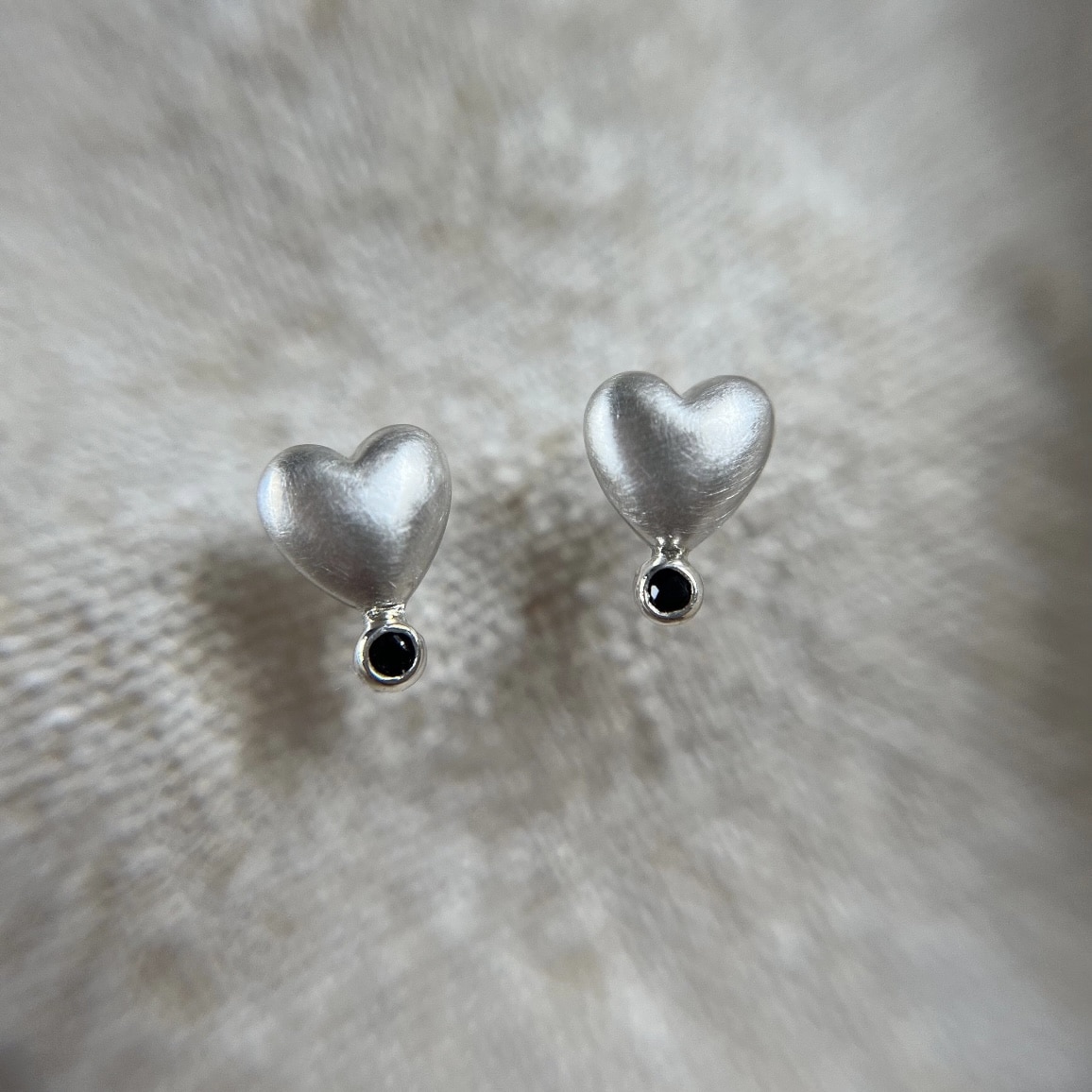 Sterling silver heart shape ear stud with natural black sapphire - main product image