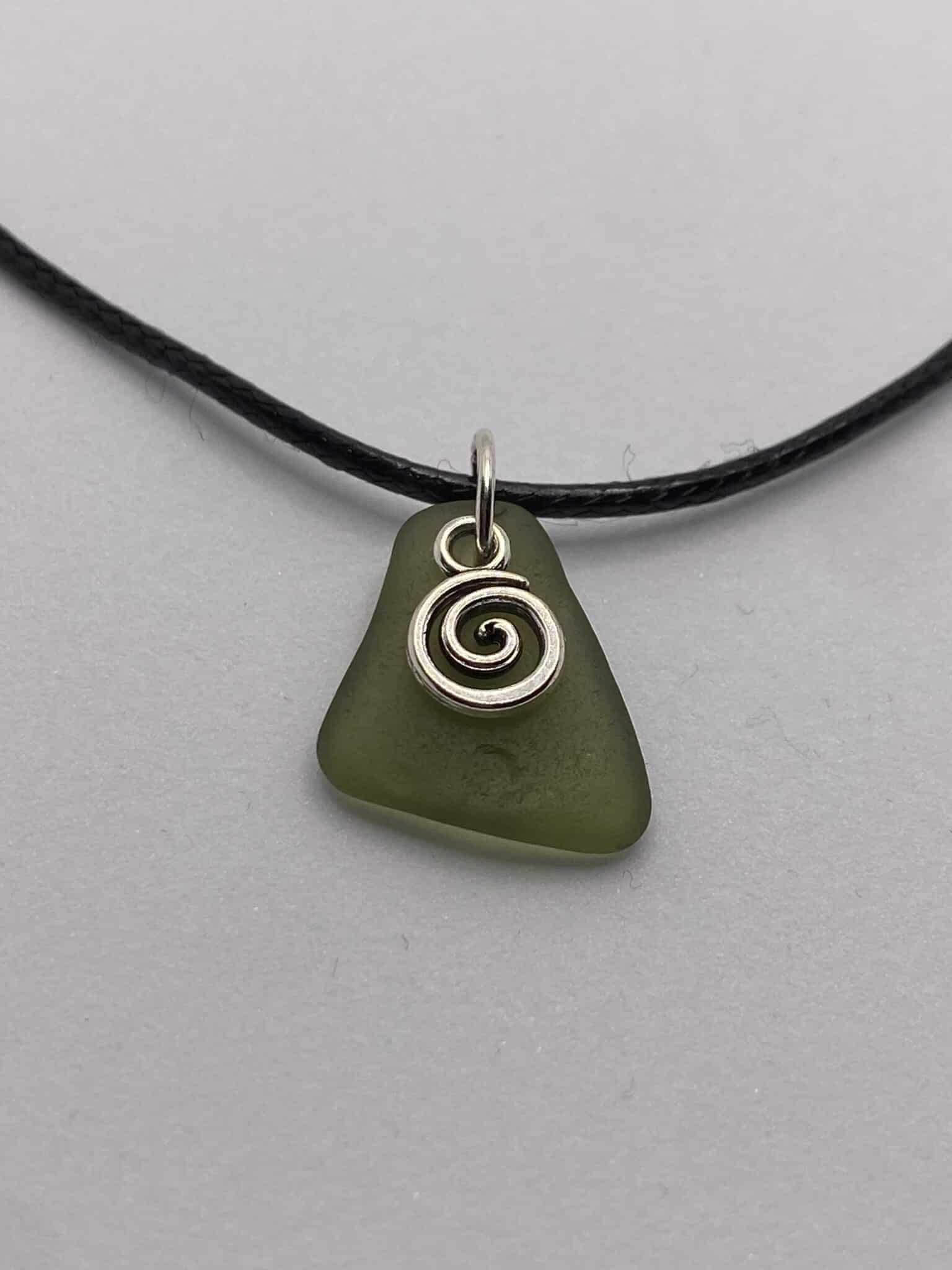 Green sea glass & charm pendant on 16 inch black cord necklace - main product image