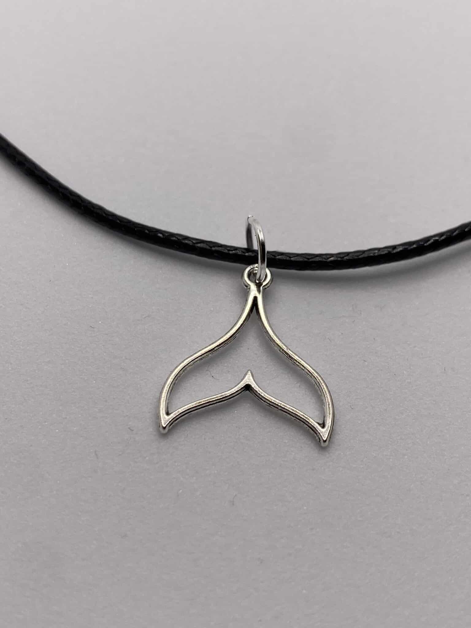 Silver coloured mermaid tail pendant on 16 inch black cord necklace - main product image