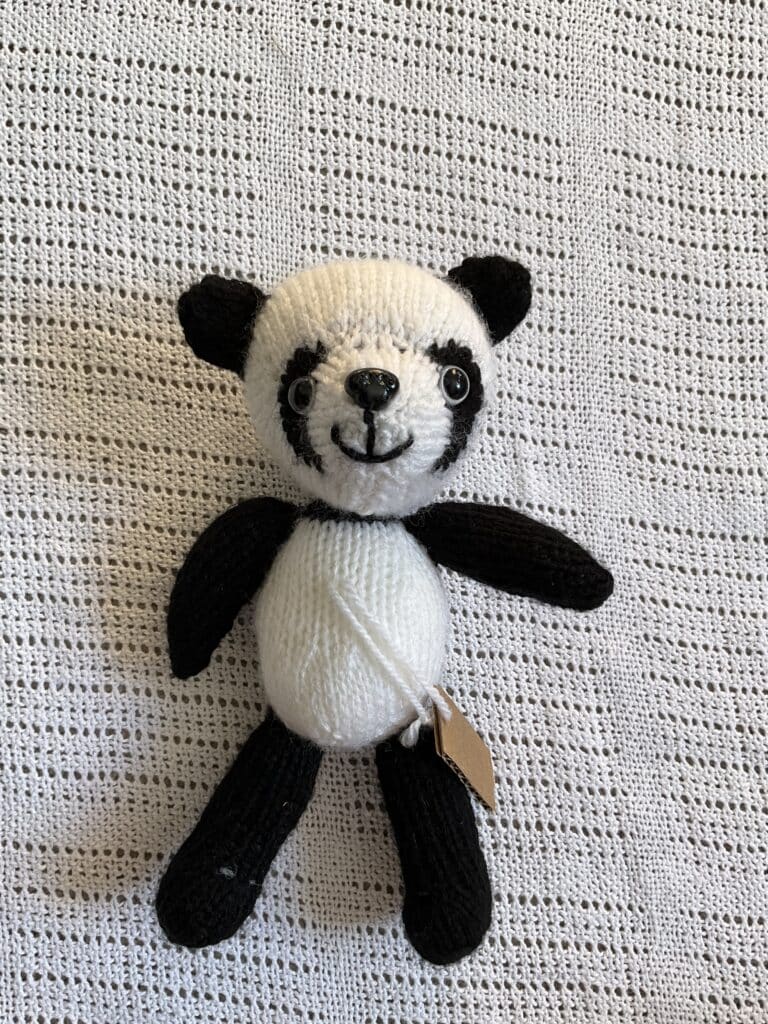Handknitted little Panda Cub