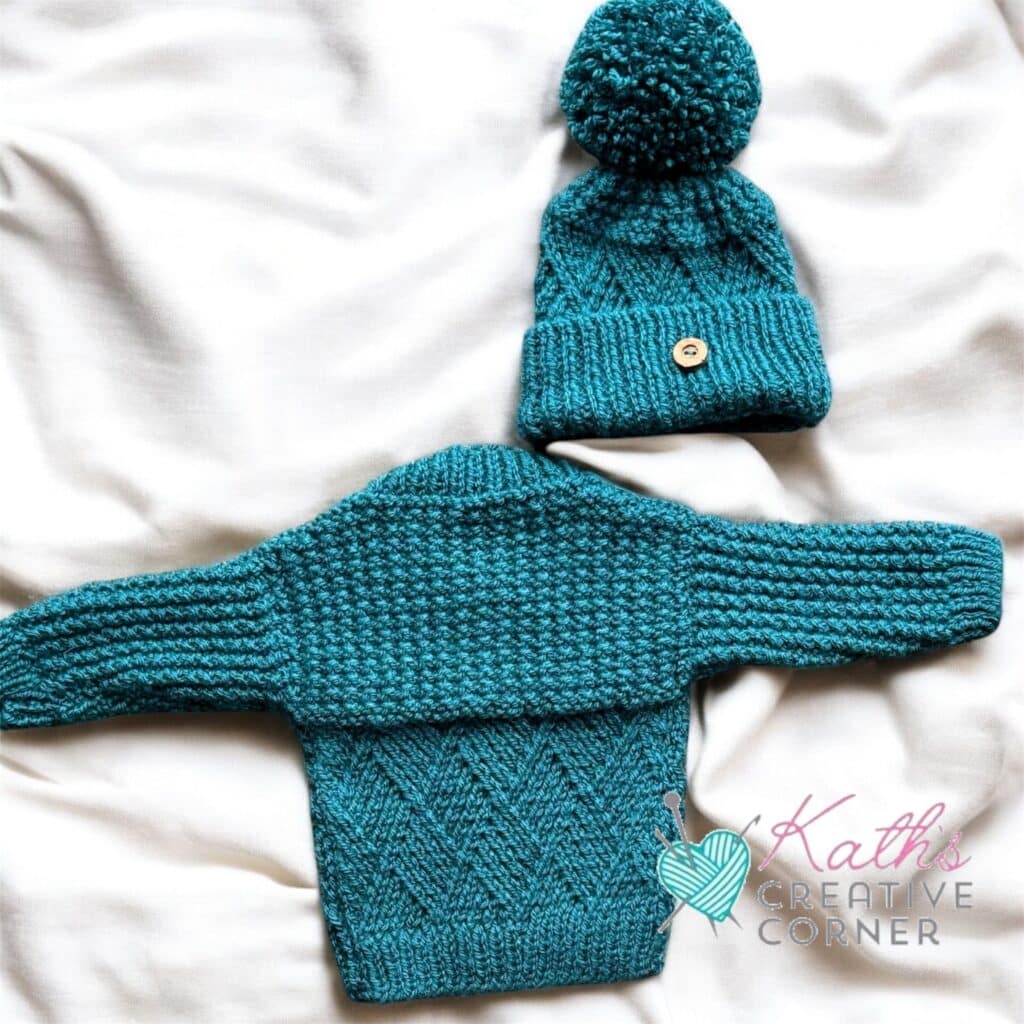 Hand knitted baby cardigan and hat in Teal