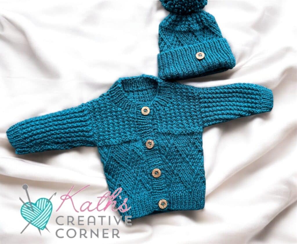 Hand knitted baby cardigan and hat in Teal