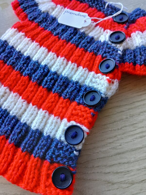 Hand-knitted baby top in red, white and blue. Approx premature. - product image 3