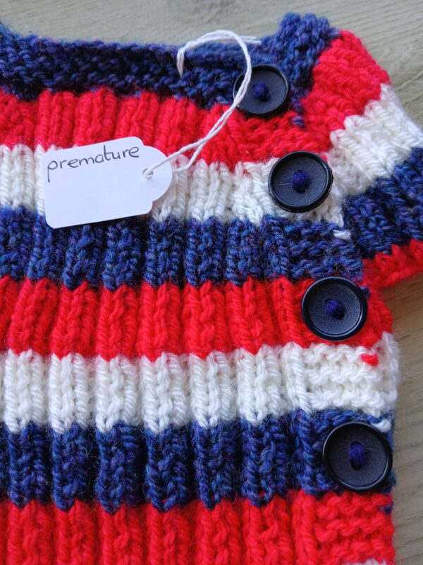 Hand-knitted baby top in red, white and blue. Approx premature. - product image 2