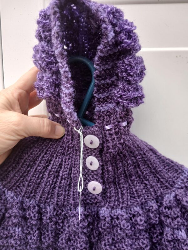 Hand-knitted baby hooded jumper in purple. Approx 0 to 3 mths. - main product image