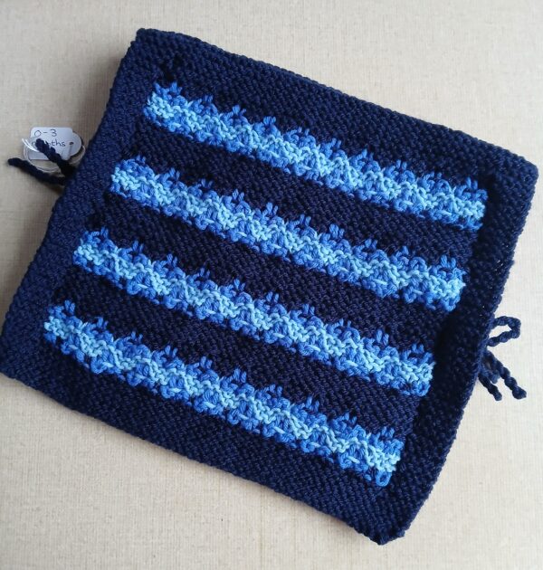 Hand knitted baby poncho with ties. Blue. Approx 0 to 3 mths. - main product image