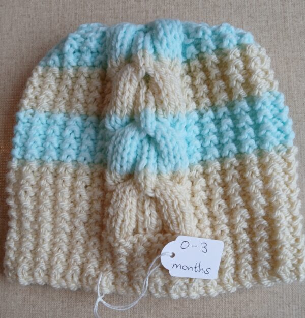 Hand-knitted baby hat in cream and turquoise. Approx 0 to 3 mths - main product image