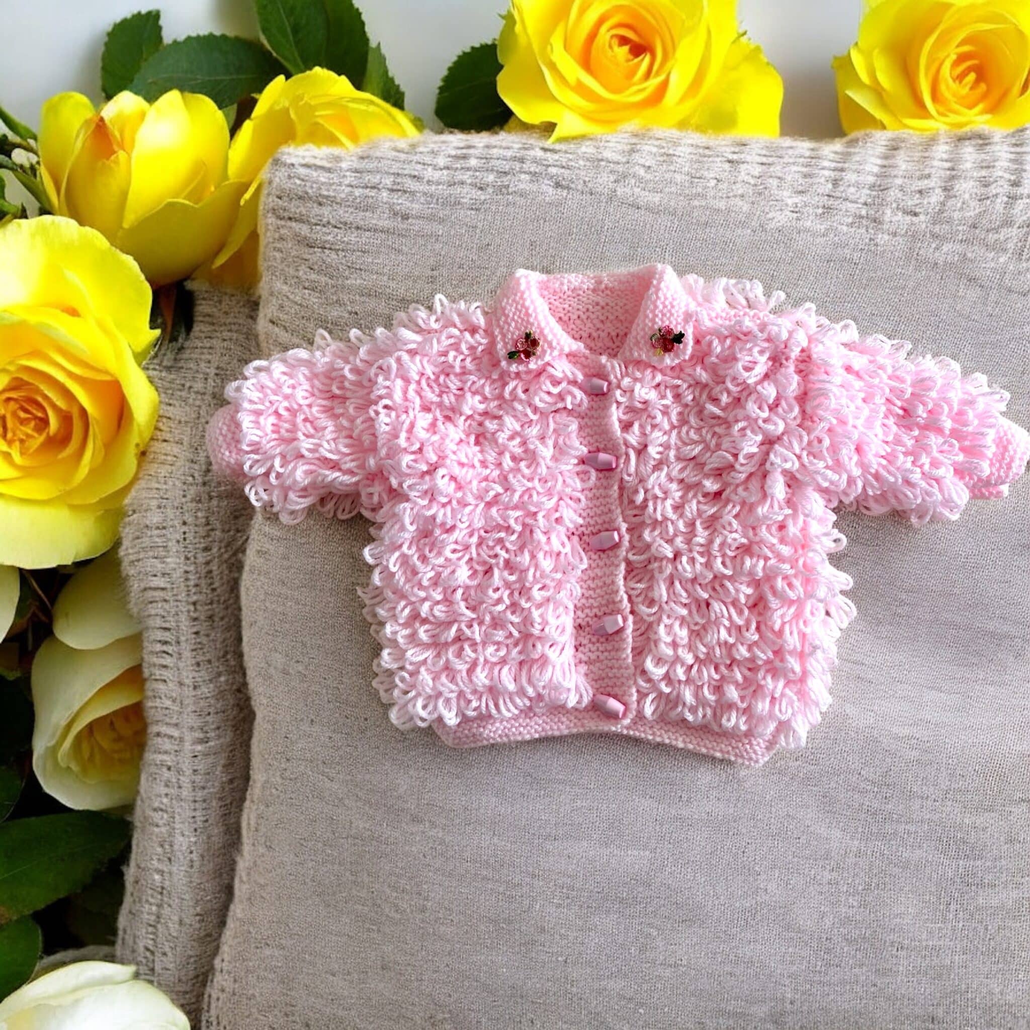 Hand knitted loopy cardigan in pink - main product image