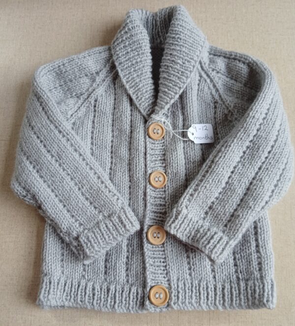 Handknitted baby boy’s cardigan. Approx 9 to 12 months old. All proceeds to charity. - main product image