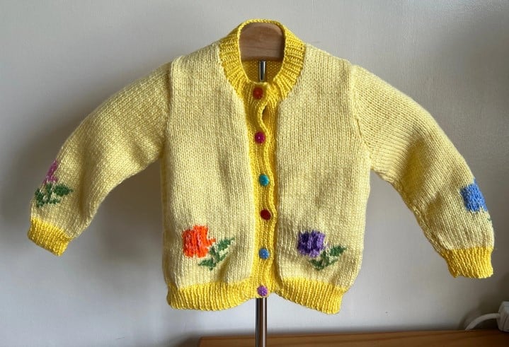 Handknitted lemon / gold flower cardigan size 20” chest - main product image