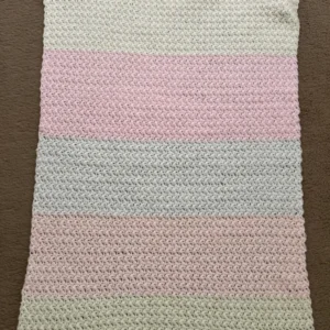 Hand crocheted blanket in pink/white/cream size 15”x 22”