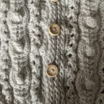 Hand knitted baby Aran hooded coat