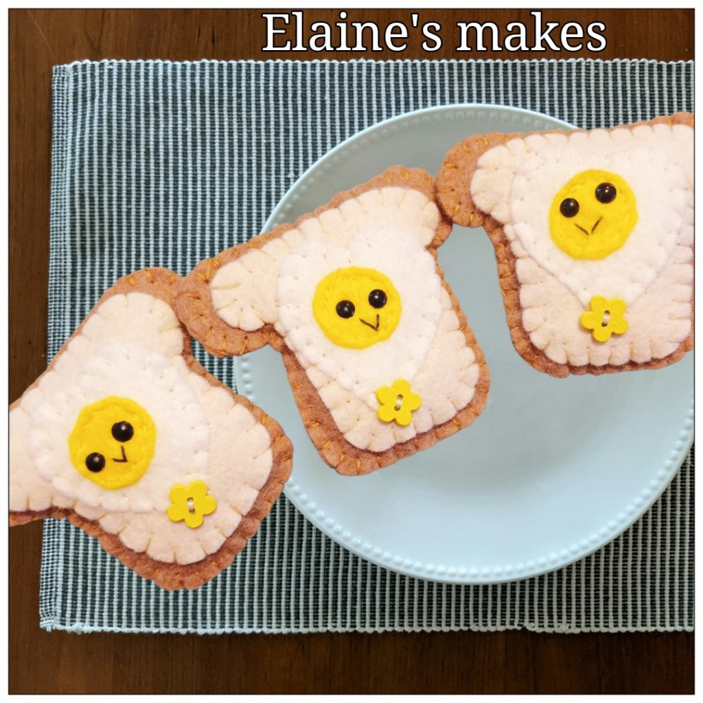 Hand sewn wool blend felt ‘heart egg on toast’ pocket hug and pocket hug card (flower button) - main product image