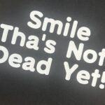 Black Tote with Smile Thas Not Dead Yet slogan, shopper,