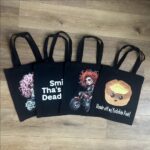 Black Tote with Smile Thas Not Dead Yet slogan, shopper,