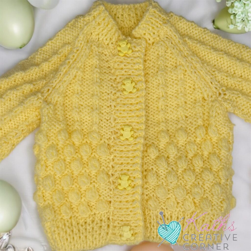 Hand knitted baby cardigan and booties