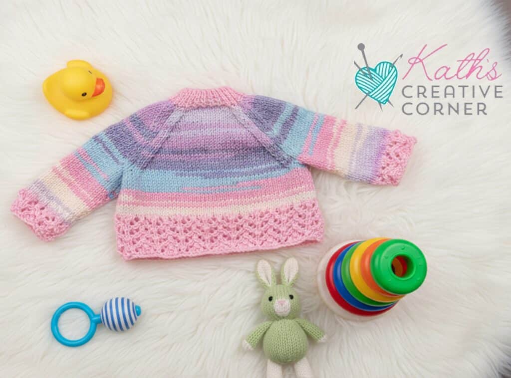 Hand knitted baby girls pink and lilac cardigan