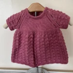 Hand knitted girls pink dress chest 20” (6-9 months approx)
