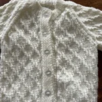 Beautiful patterned hand knitted cream cardigan size 20” (6-12 months)