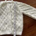 Beautiful patterned hand knitted cream cardigan size 20” (6-12 months)