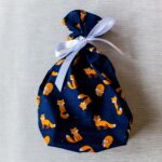 Small fabric gift bag, cute foxes on a navy blue background