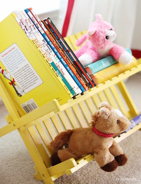 IKEA dish drainer reused as a yellow book caddy for kids.