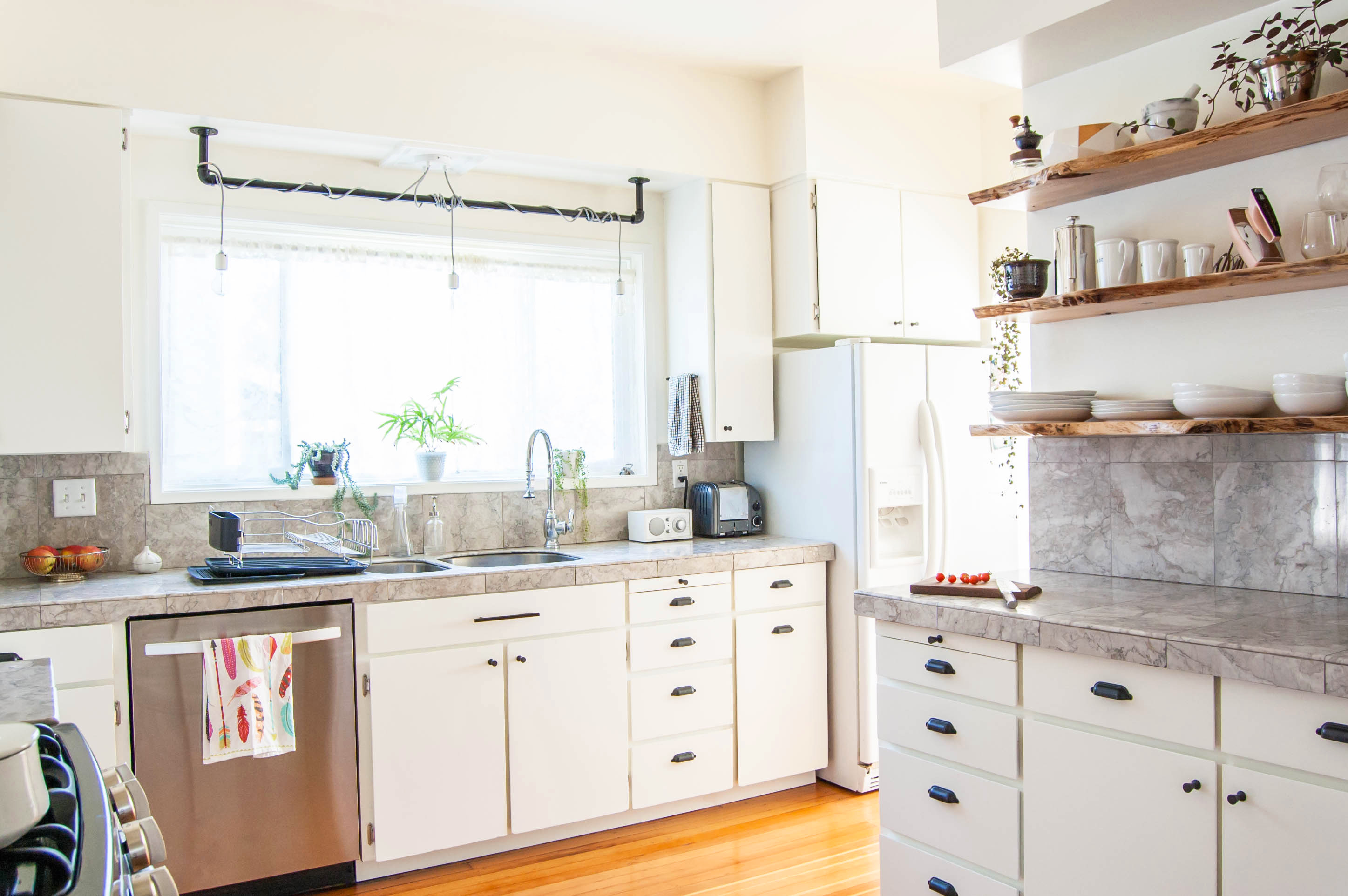 Here S How Hidden Cabinet Hacks Dramatically Increased My Kitchen Storage Apartment Therapy