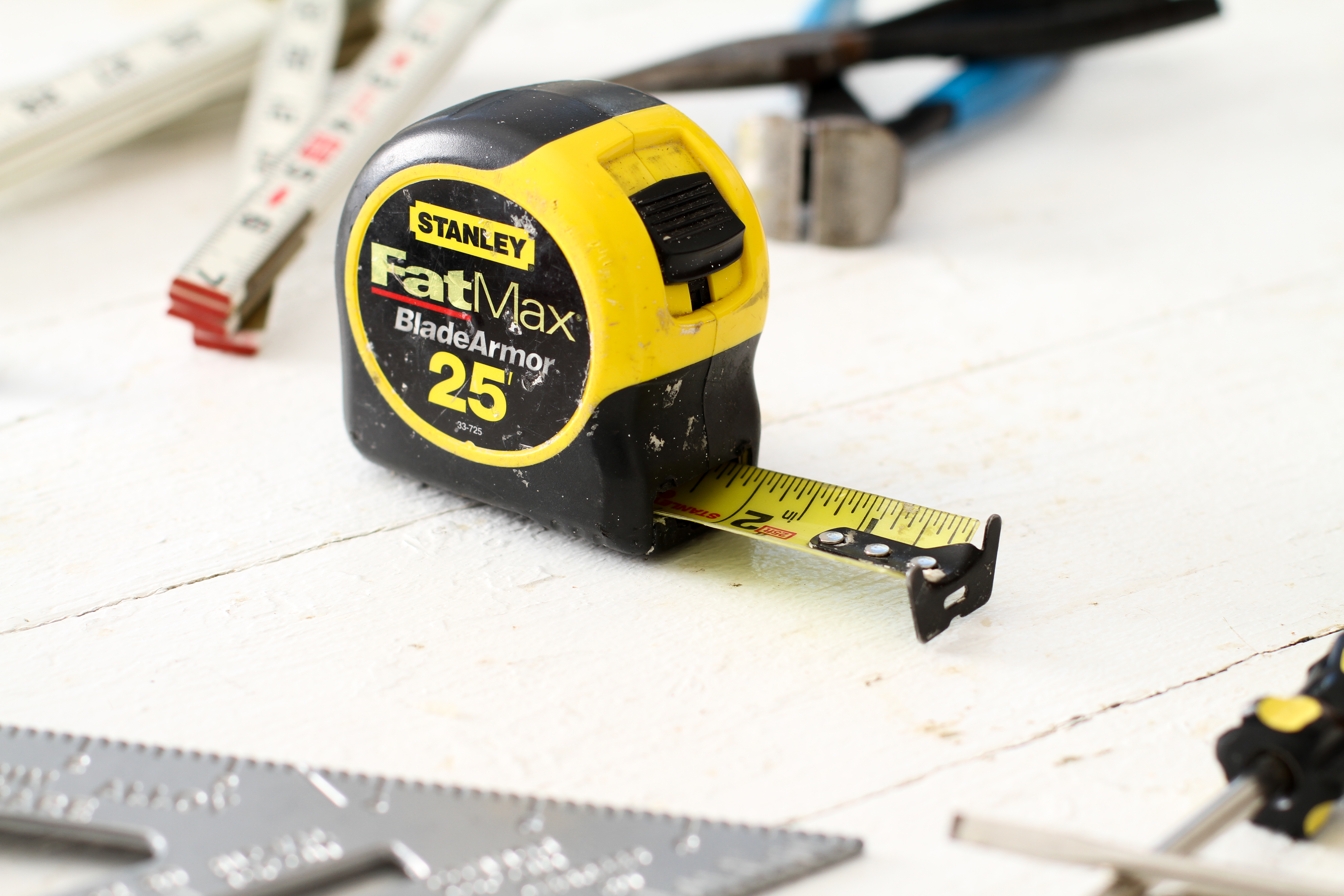 Top view of yellow soft measuring tape. Minimalist flat lay image of tape  measure with metric