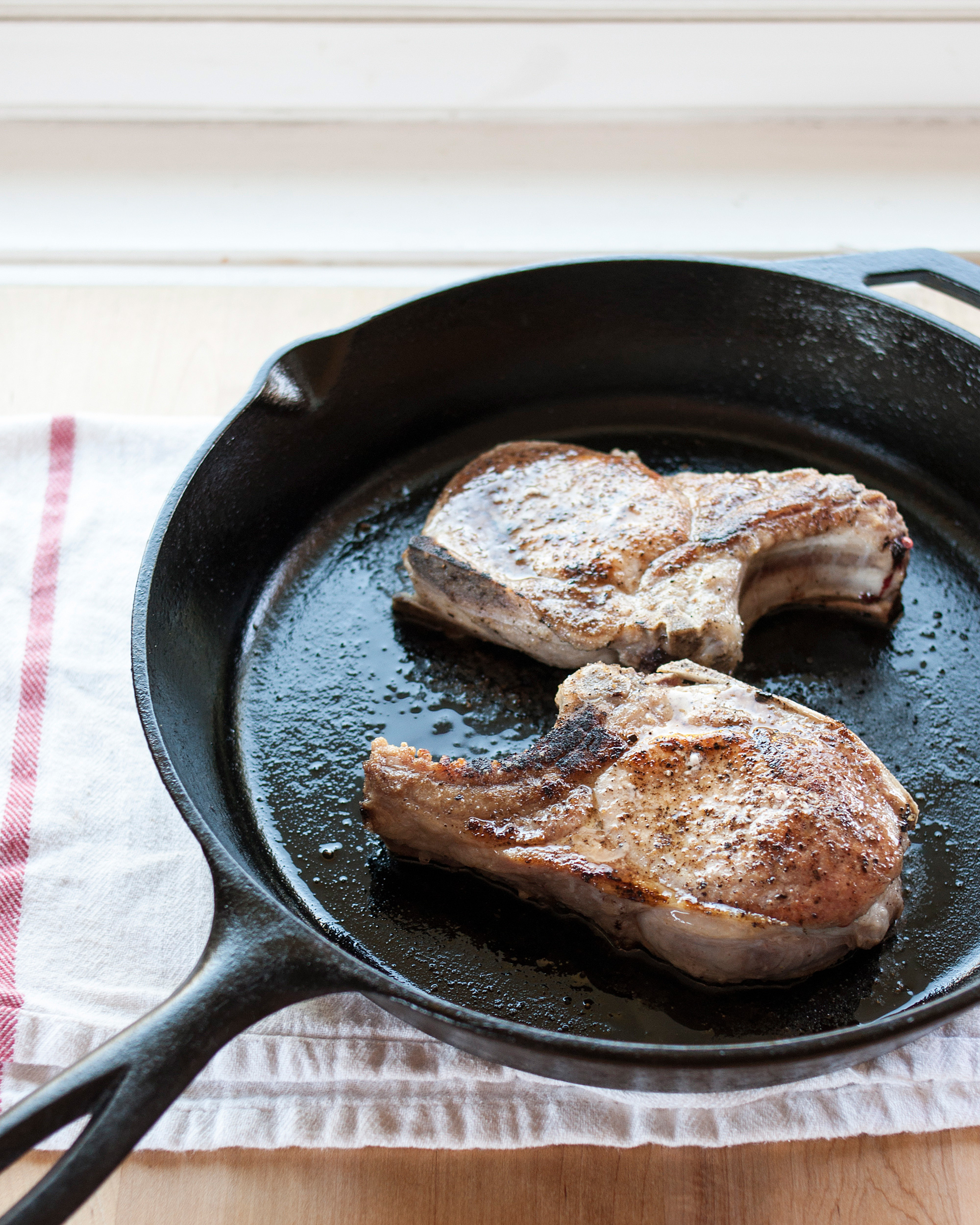 Raw Meat Cooking in Frying Pan on Stove Top Stock Photo - Image of