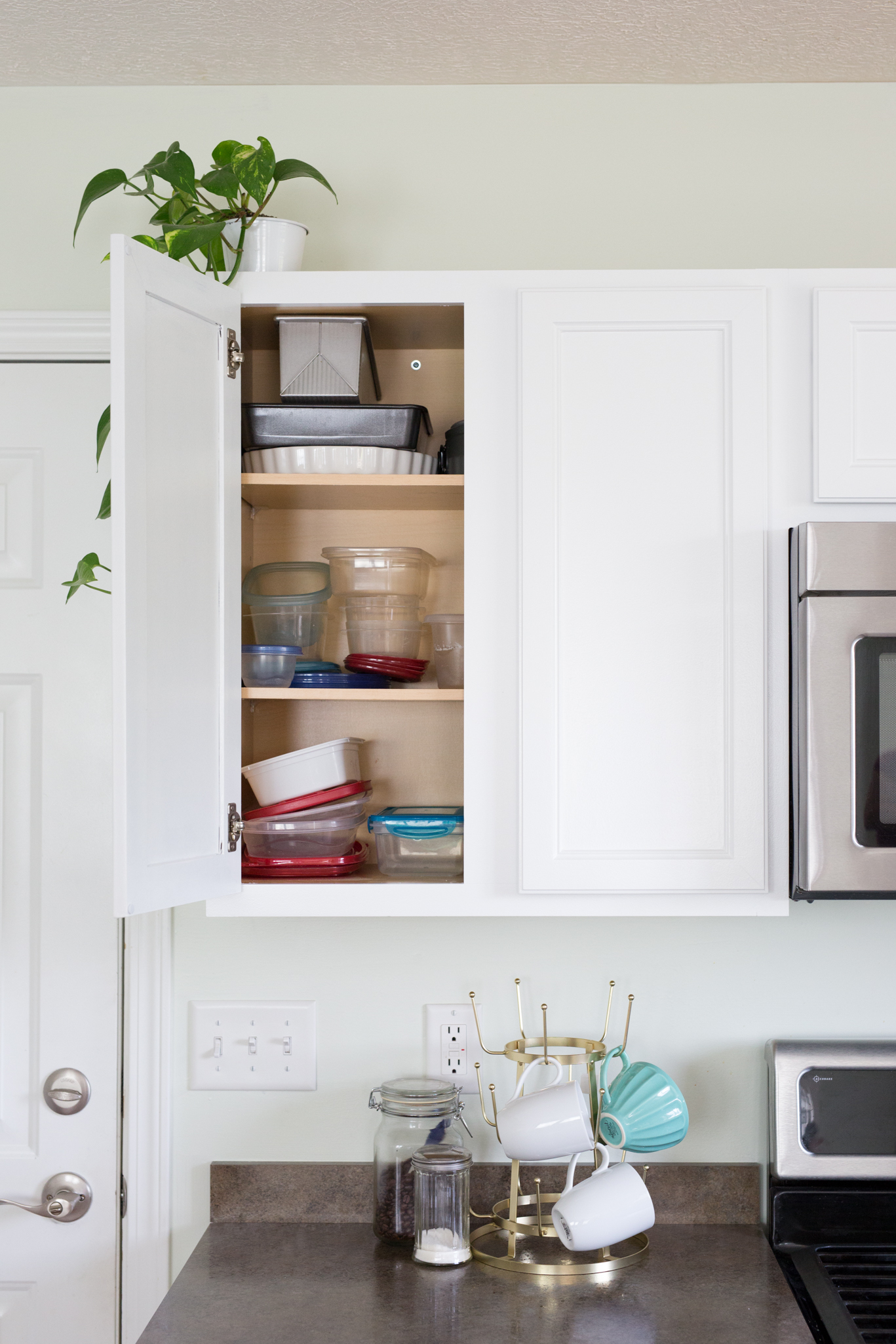 Kitchen Cabinet Organization {Taming the Tupperware} - Sand and Sisal