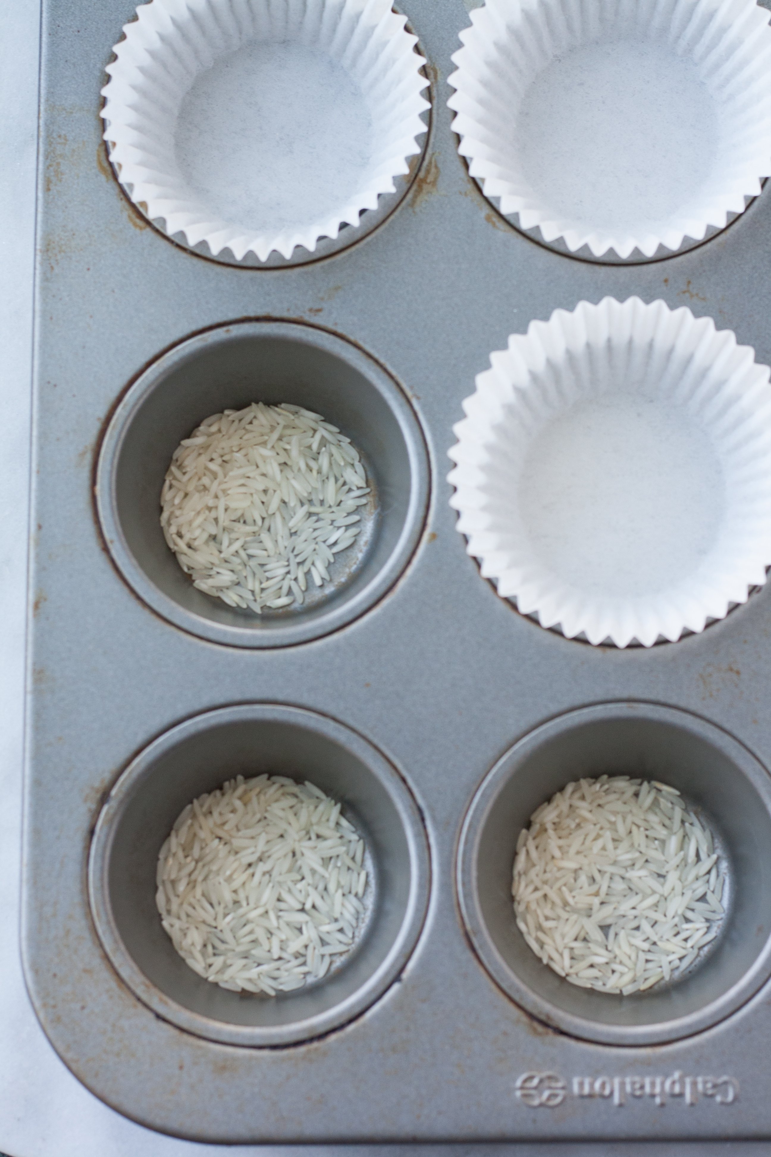 Does Adding Uncooked Rice to the Bottom of a Muffin Tin Actually Work?